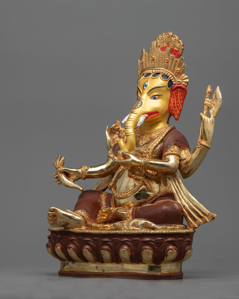 4 arm ganesha-sculpture